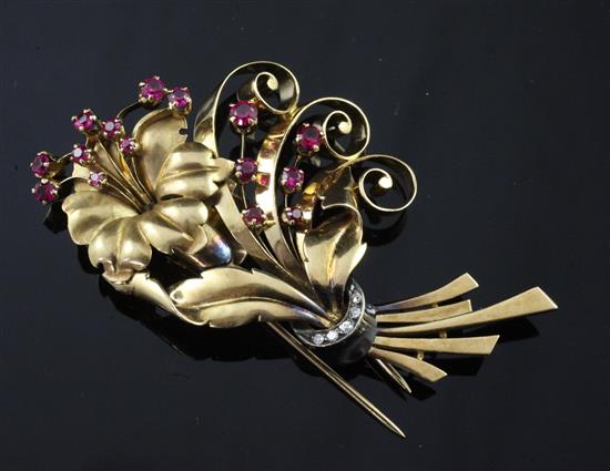 A middle eastern high carat gold , diamond and pink gem set floral spray clip brooch, 3in.